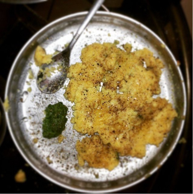 Surti locho — soft steamed gram-flour savoury topped with butter and spice